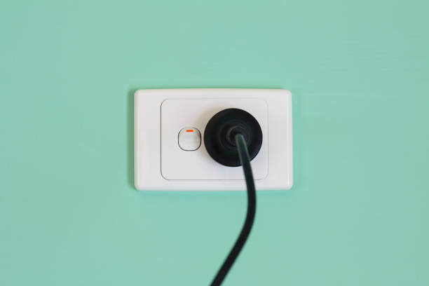 Australian electric power wall outlet and power cord that illustrates the concept of expensive electric power.