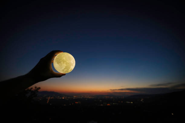 istock Man holding moon over Salt Lake City with Fireworks 814661068
