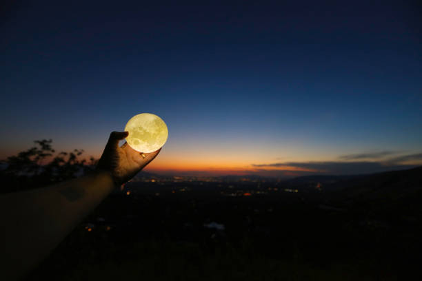 istock Man holding moon over Salt Lake City with Fireworks 814661072