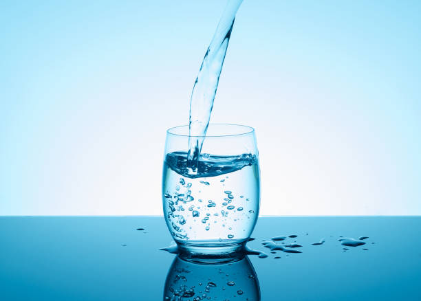 istock Creative splashing water in the glass 814663674