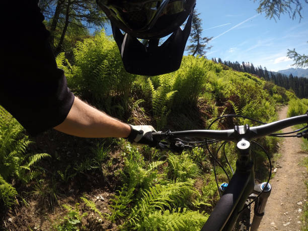istock Mountain biker looking at his bike 814663790