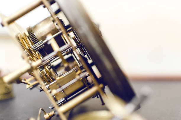 Old golden broken watch mechanism on the shelf