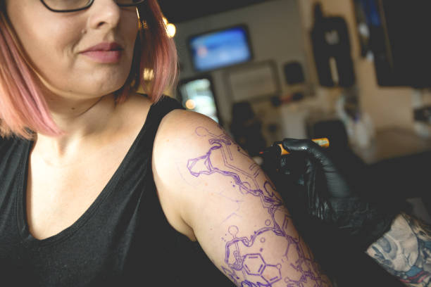 istock Female Customer Having Arm Prepped for Tattoo 814705940