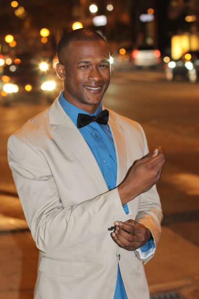 istock Elegant man smiling in the city 814715108