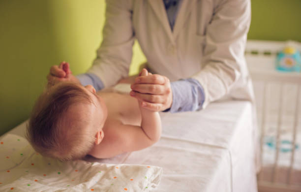 istock Cute baby at the doctor office 814722732