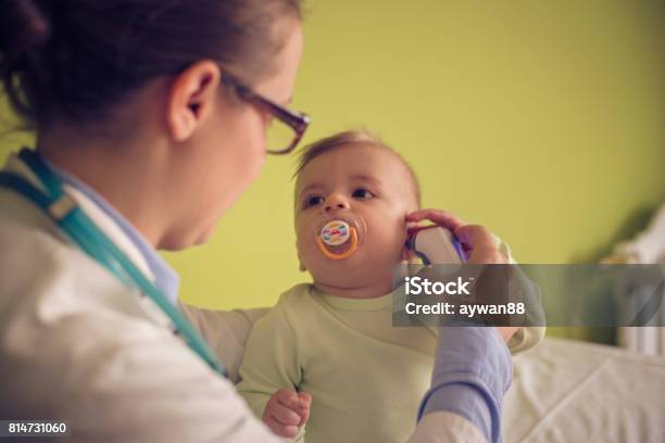 Doctor Checks The Temperature Of A Baby Boy Stock Photo - Download Image Now - Pediatric Nurse, Baby - Human Age, Doctor