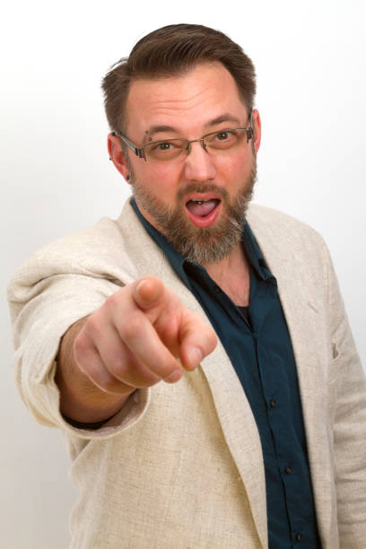 istock Bearded man is calling and gestures with his finger 814751040