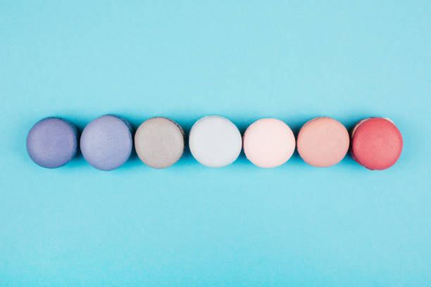 istock Group of pastel colorful macarons on trendy background 814751204