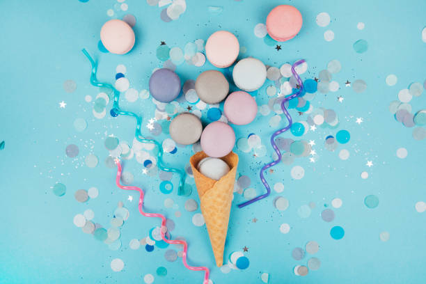 istock Group of pastel colorful macarons on trendy background 814756380