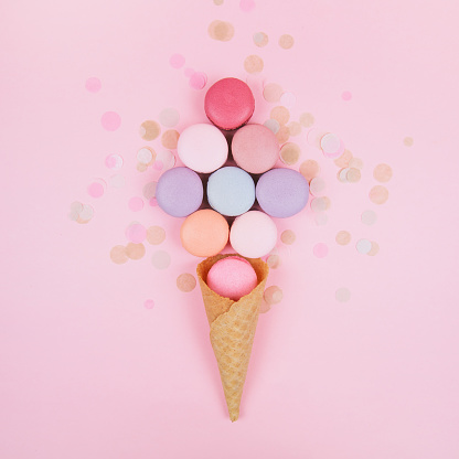 Group of pastel colorful macarons on trendy background.