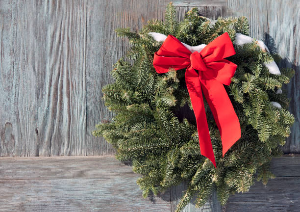 istock Christmas wreath on a wooden door 814761356