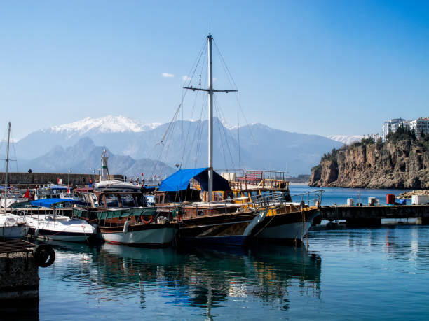 istock people in Antalya harbor 814780550