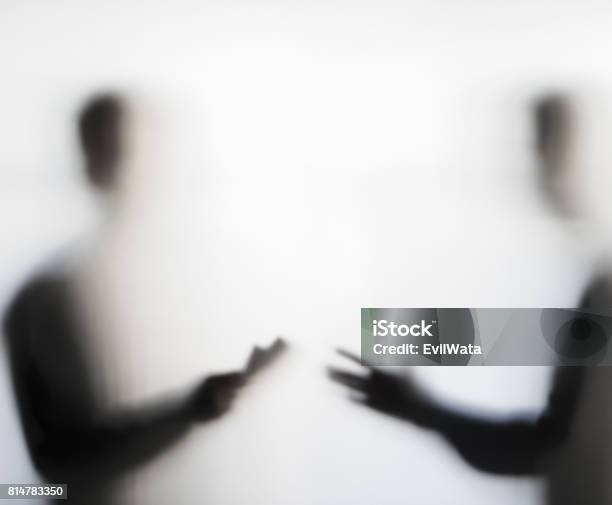 Two Men Negotiating Behind Curtain Stock Photo - Download Image Now - Corruption, Bribing, People