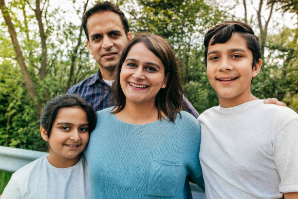istock Smiling family with two kids 814783506