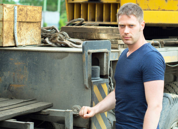 istock Male worker near the mobile crane. 814790756
