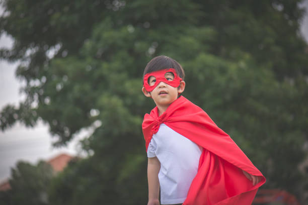 istock Asian child in in Superhero's costume playing 814790872