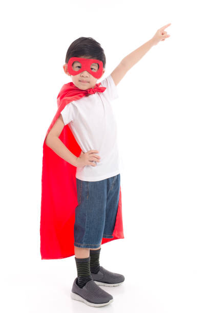 istock Cute Asian child  in Superhero's costume pointing 814790938