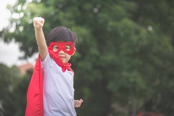 istock Asian child in in Superhero's costume playing 814790962