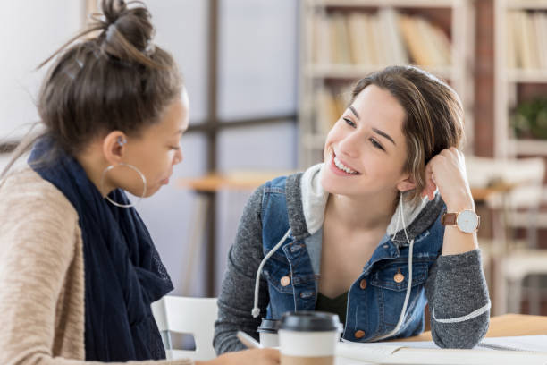 istock Friends catch up in college student center 814797054