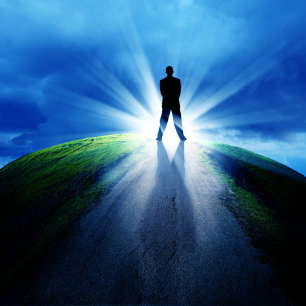 istock silhouetted businessman on empty road 814802226
