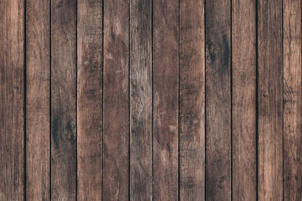 istock Vintage surface wood table and rustic grain texture background. Close up of dark rustic wall made of old wood table planks texture. Rustic brown wood table texture background template for your design. 814804342