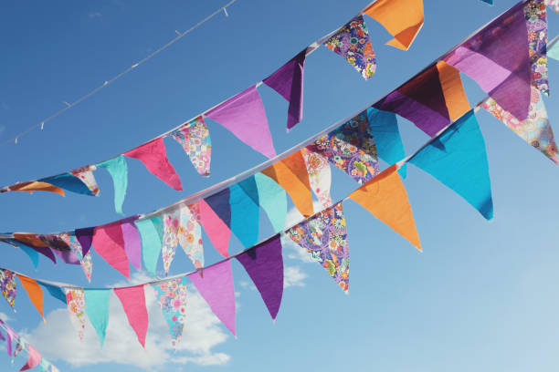 istock Summer festive colorful bunting and blue sky 814811760