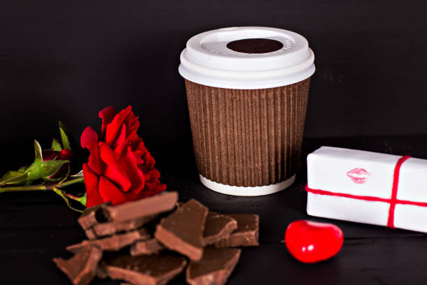 istock A glass of coffee, chocolate, a red rose, a gift. 814812212