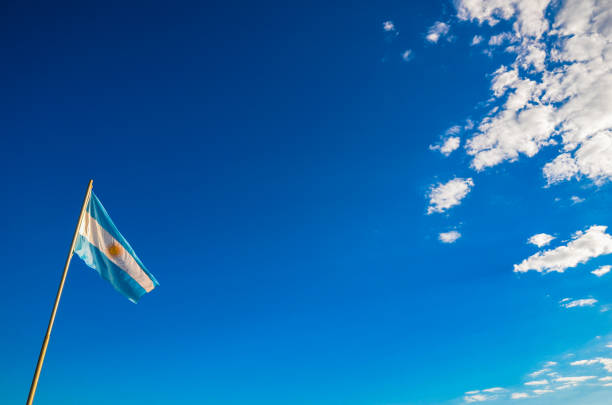 Argentina flag waving against blue sky