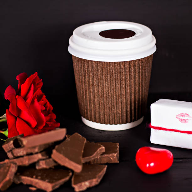 istock A glass of coffee, chocolate, a red rose, a gift. 814814494