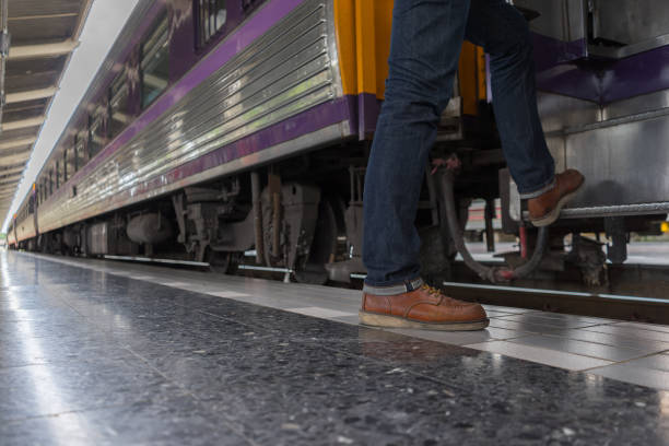 istock man traveler with backpacker at trainstation 814876680