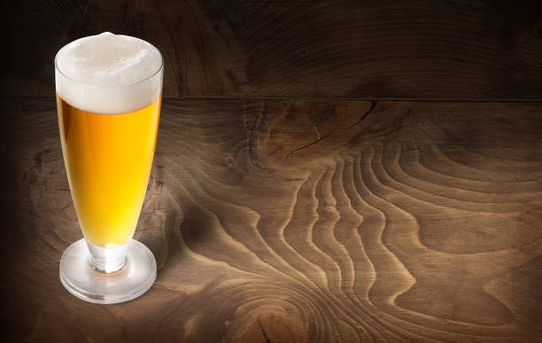 istock beer glass on wooden 814909308