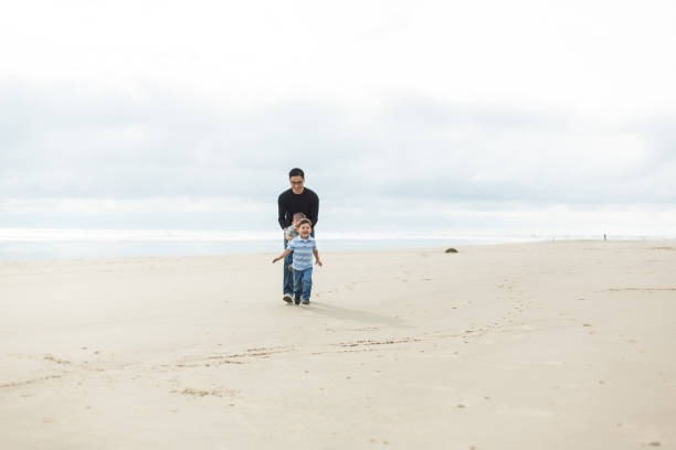 istock Family day at the beach 814928218