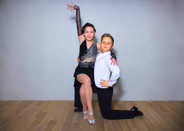 istock The young boy and girl posing at dance studio 814939886