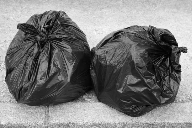 istock Two black garbage bags on the ground. Recycle 814953530