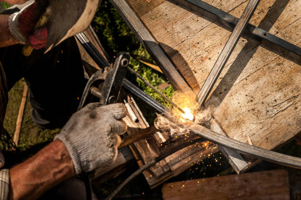 istock Welder working with metal construction outdoor 814956588