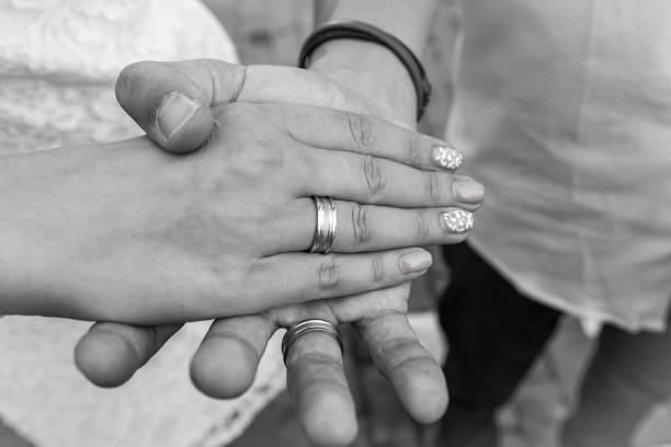 istock Hands of bride and bridegroom with rings 814962228