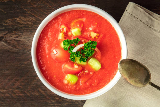 istock Bowl of gazpacho soup on rustic texture with copyspace 814962650