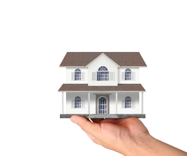istock Mortgage concept by house from in hand 814962906