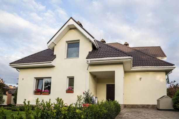 istock Private house with a garden in a rural area under beautiful sky 814976964
