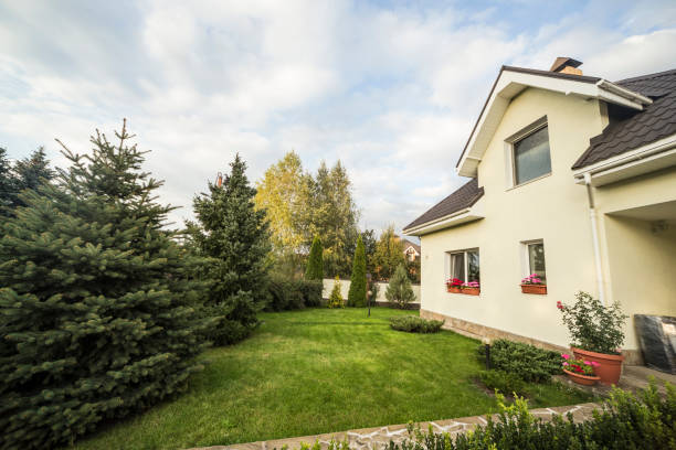 istock Private house with a garden in a rural area under beautiful sky 814976986