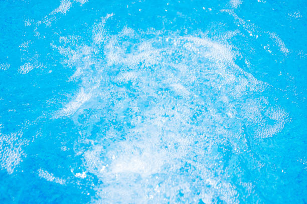 istock Blue clear fresh Water in hot tub. Spa massage background. 814979320