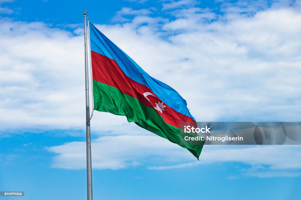 Azerbaijan Flag Azerbaijan flag with blue sky background. Azerbaijan Flag Stock Photo
