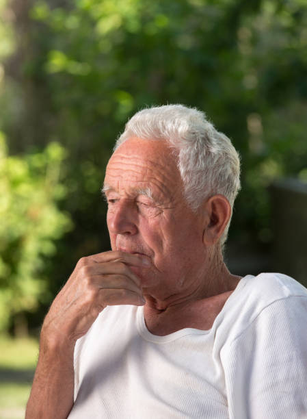istock Portrait of old man in park 814982872