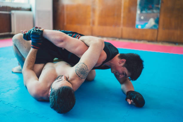 istock MMA fighters fighting in the gym 814985492