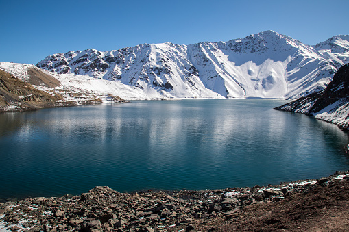 Lake by rocky mountains at Embalse el Yeso, Chile.