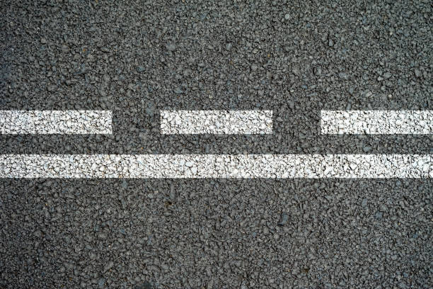 istock white lines and dashed lines on the asphalt road in the middle 814989530