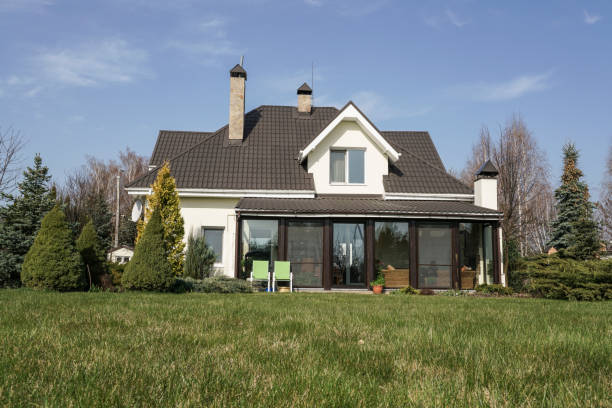 istock Private house with a garden in a rural area under beautiful sky 814992664
