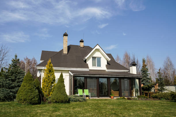 istock Private house with a garden in a rural area under beautiful sky 814992668