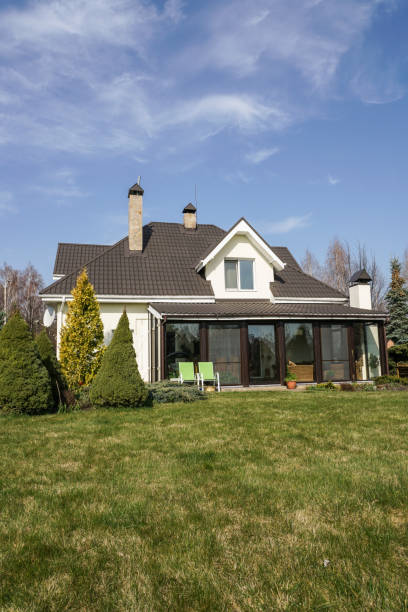 istock Private house with a garden in a rural area under beautiful sky 814992676
