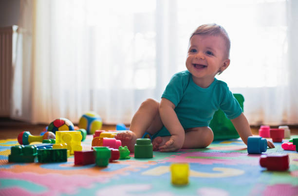 istock Adorable boy playing with toys 814995772